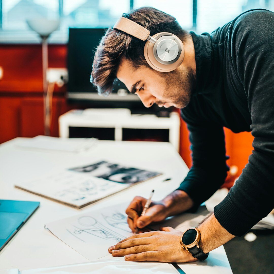 Young Croatian journalist writing notes at a desk