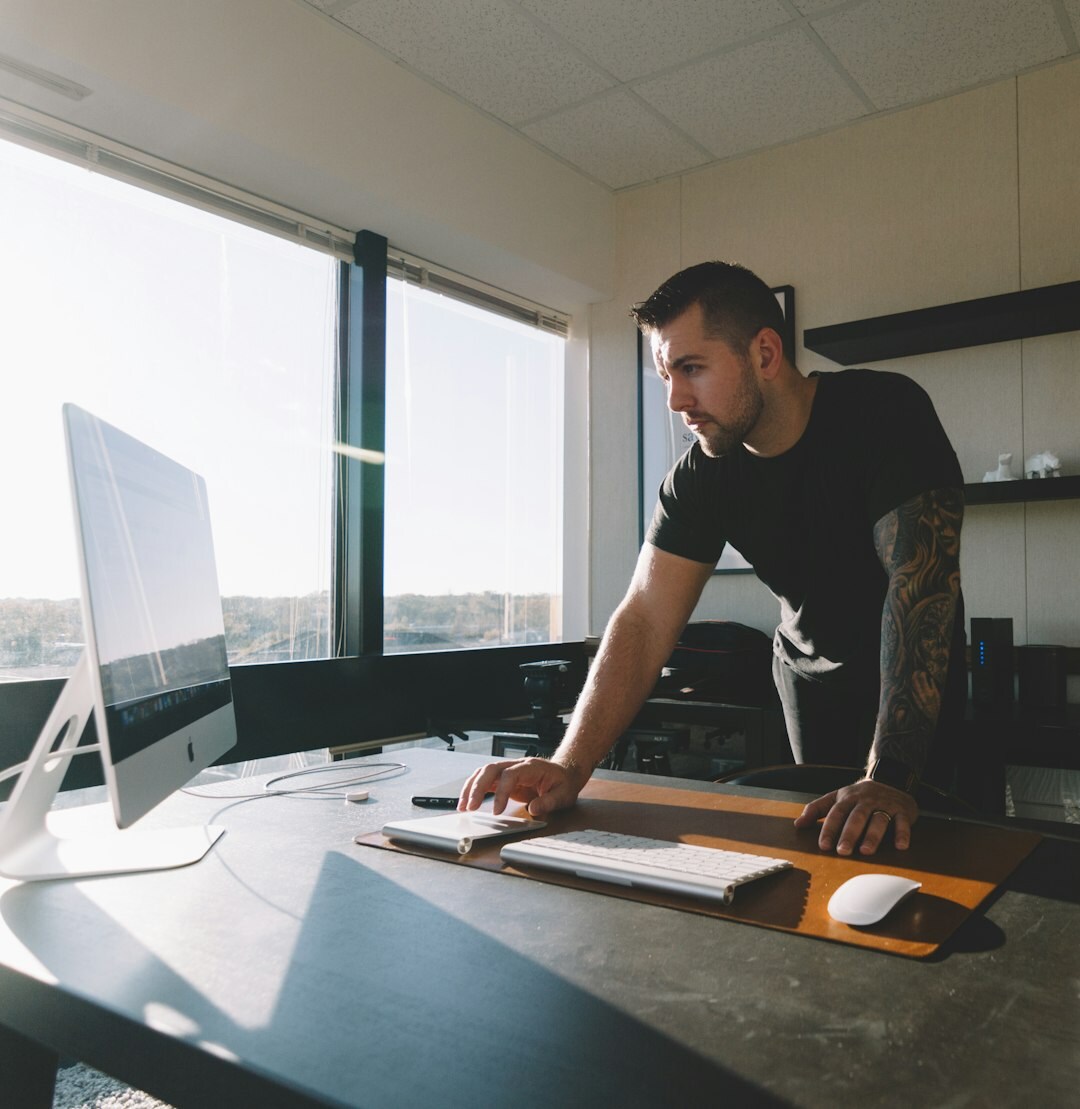 Editor reviewing event photographs on a monitor